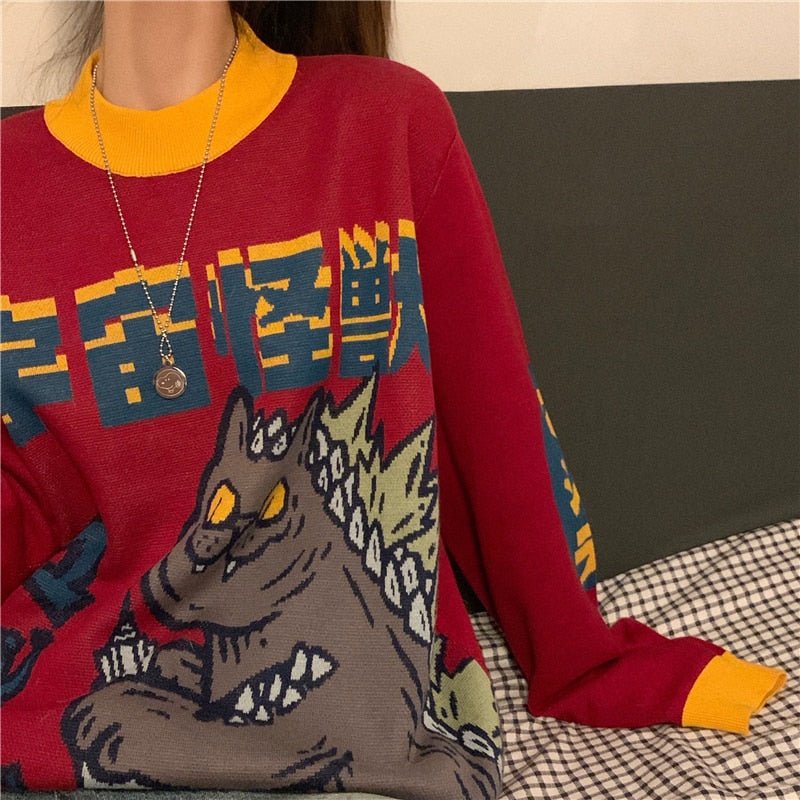 a woman wearing womens cat sweatshirt with cat monster design