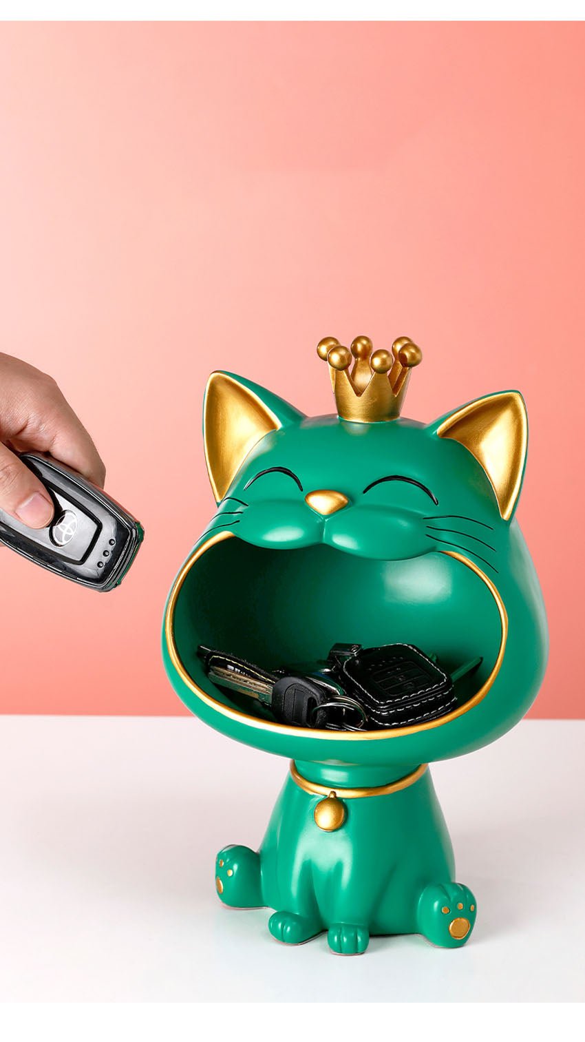 a key holder from a green cat statue