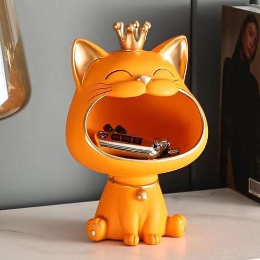 an orange cat sculpture for storage space for keys