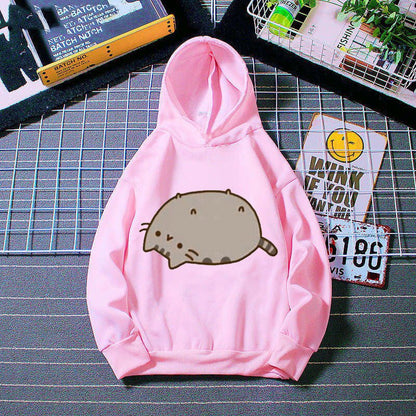 a cute cat hoodie made from cotton with a printed pusheen cat laying down on the floor feeling lazy