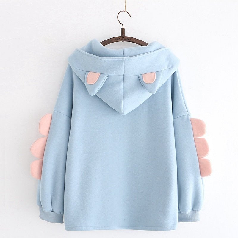 the back of a cat sweatshirt with ears in blue and pink colors