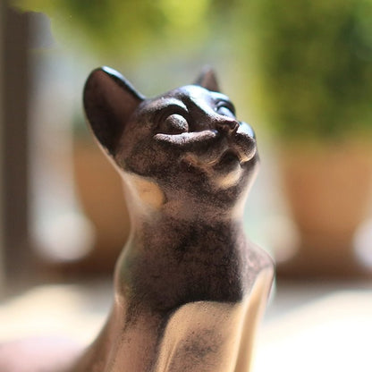 The meditating yoga master cat statue