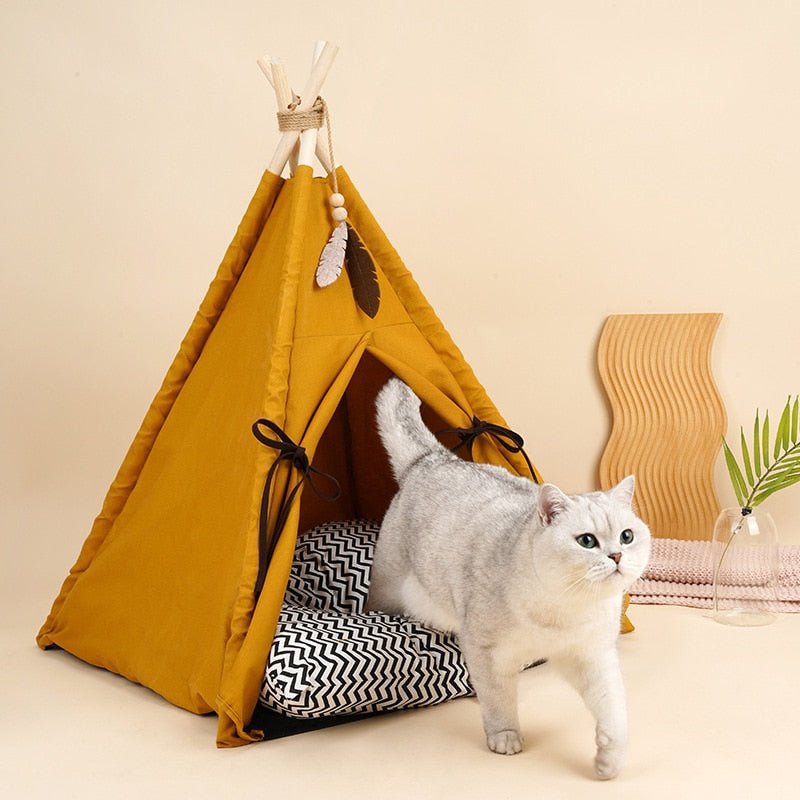 Cat enjoying its cozy time in the khaki color Native's House Cat Tent Bed that looks like a tepee of native american