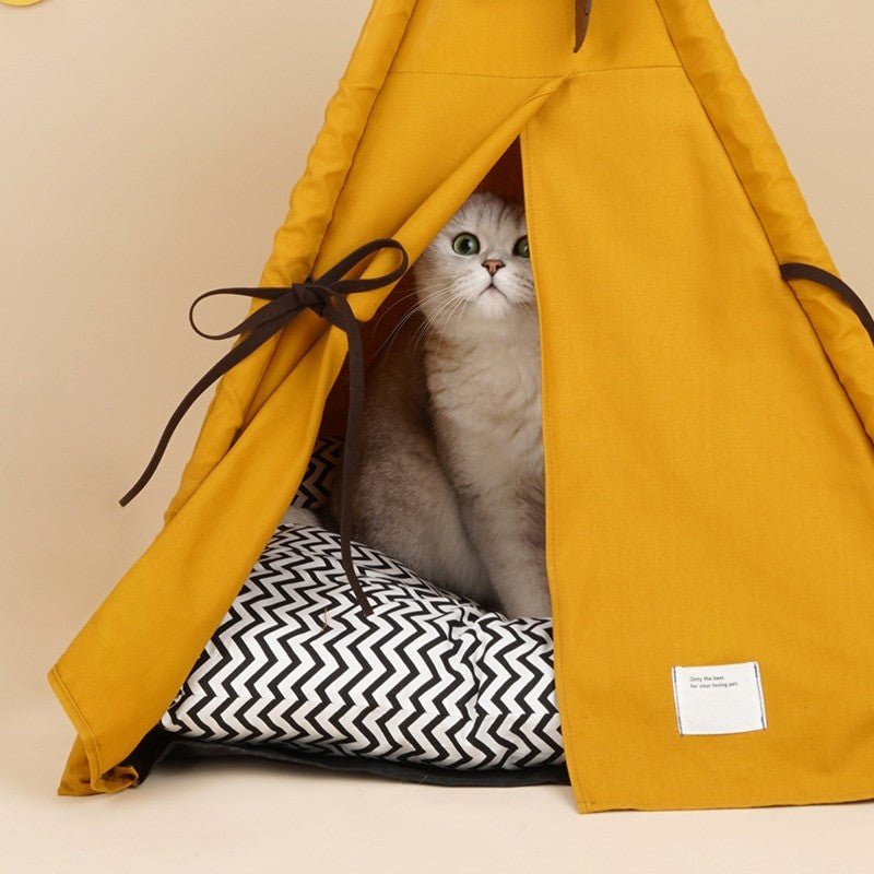 a close up picture of a minimalist design cat teepee bed with a large size comfortable cushion for indoor cat