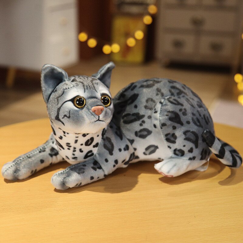 a gray cat stuffed animal of a tabby cat