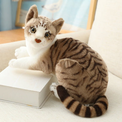 a cute real looking stuffed cats of a tabby cats