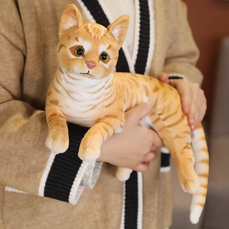 an orange stuffed cats that look real 