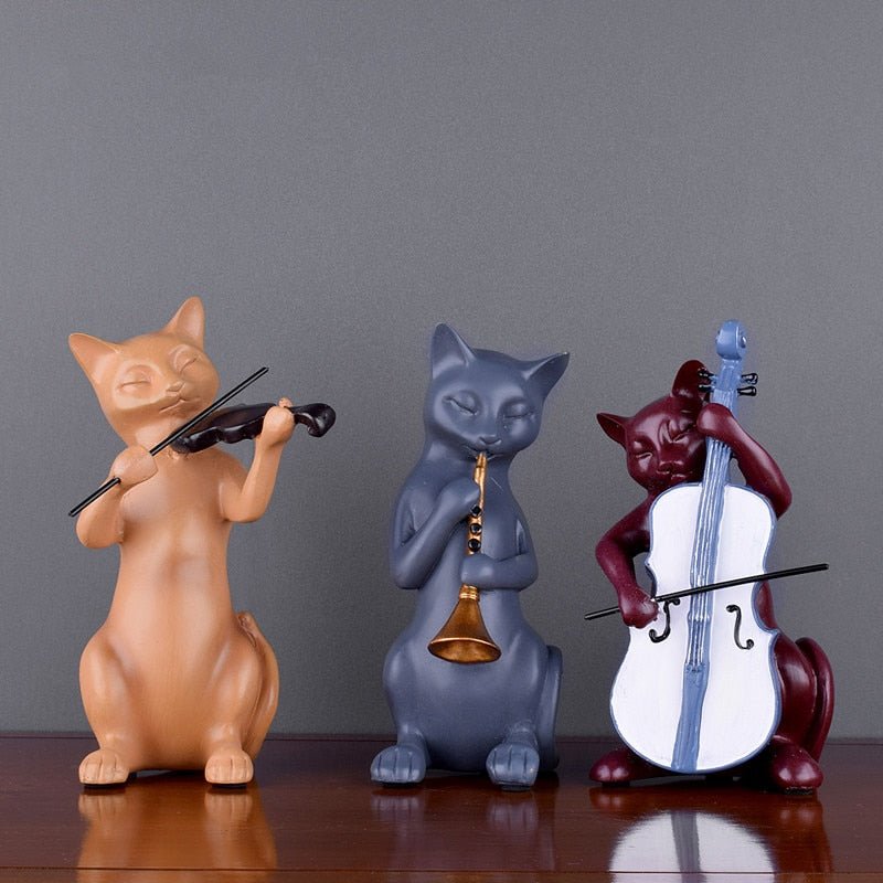 a set of mix color mini cat sculptures of cats playing musical instrument
