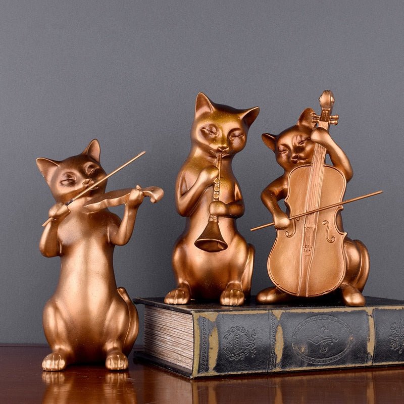 a bronze color mini cat sculpture of cats playing musical instrument for home decor