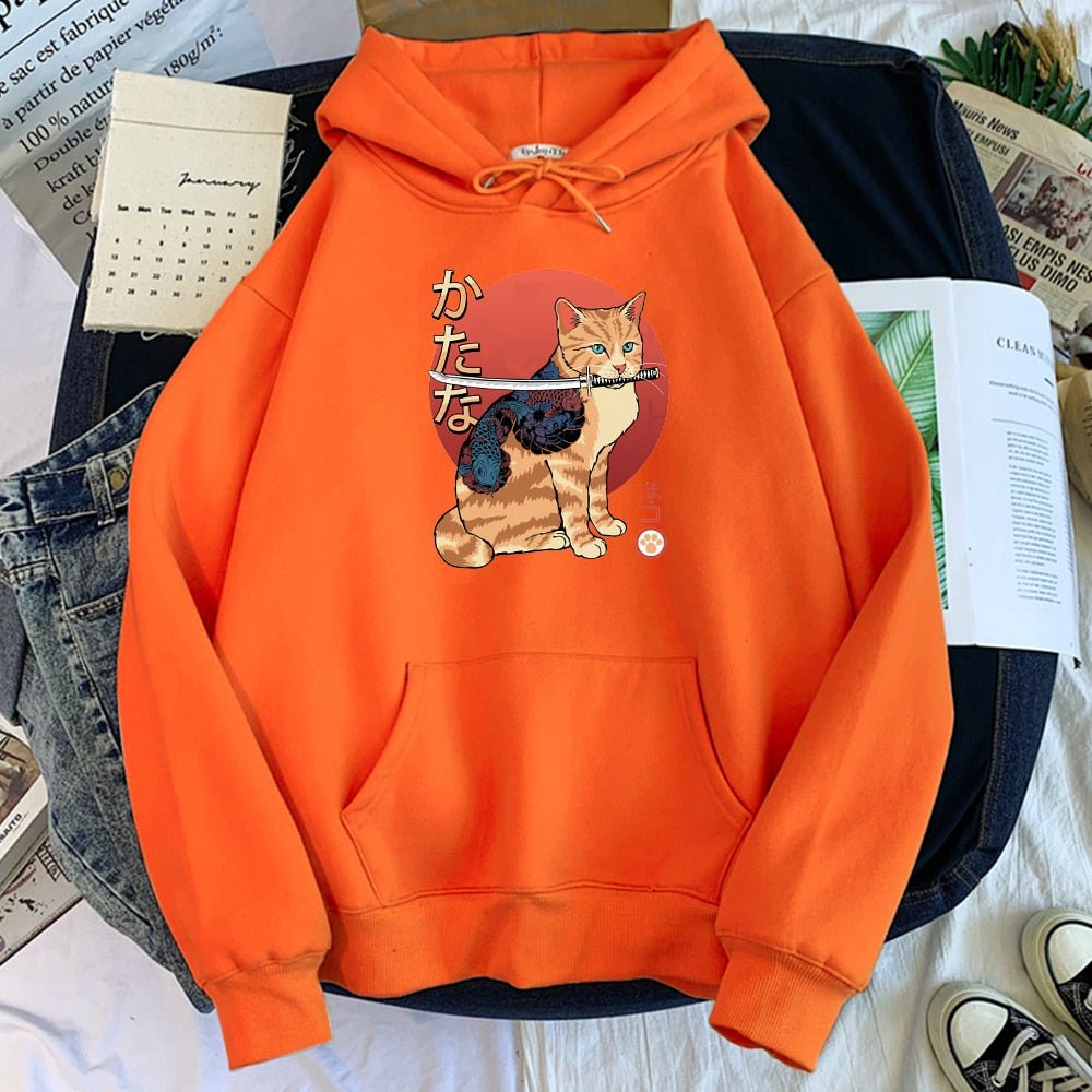 an orange color hoodie featuring a cat with samurai sword in its mounth and tatoo