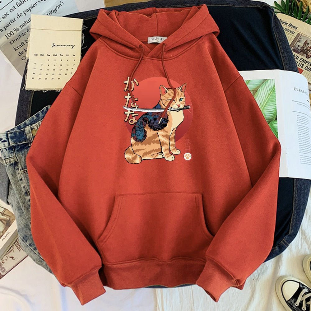 a red color hoodie with a picture of a cat brave cat with tattoo and sword