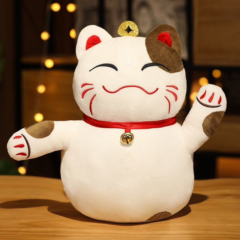 a cat plushie of a lucky cat that is very soft