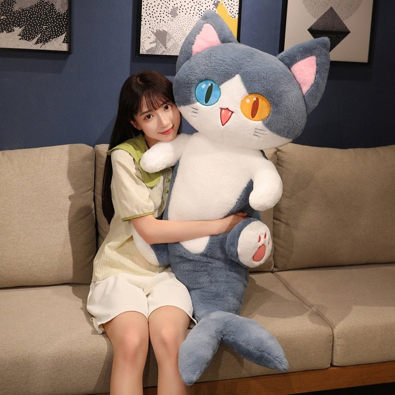 a lady hugging a big cat plushie of a cat shark