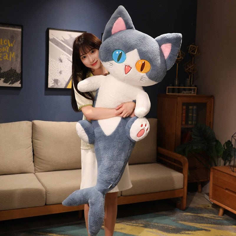 a long cat stuffed animal of a cat with shark tail