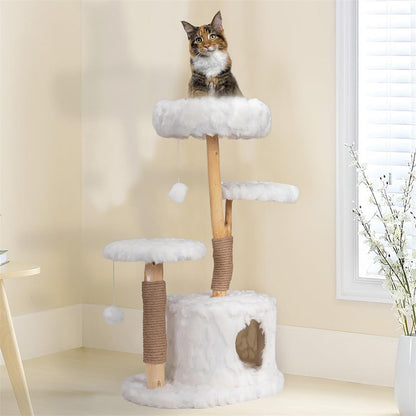 a cat sitting on a cloud cat tree that has fluffy white surface
