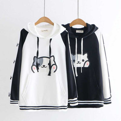 a pair of cat hoodie made for couple with a big cute cat face on it in black and white color
