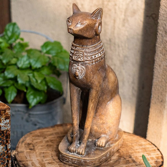 a vintage style egyptian cat sculpture with wood-like color