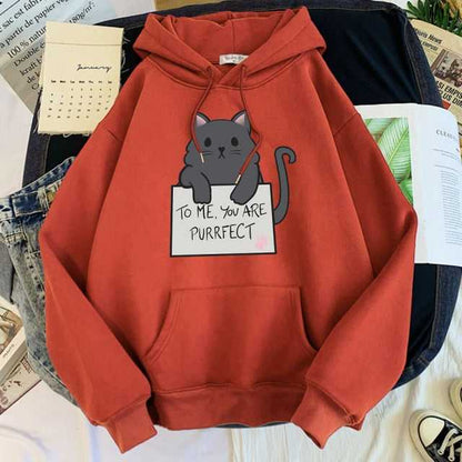 red color cat hoodie that comes with a pouch which looks adorable with a cat holding a sign