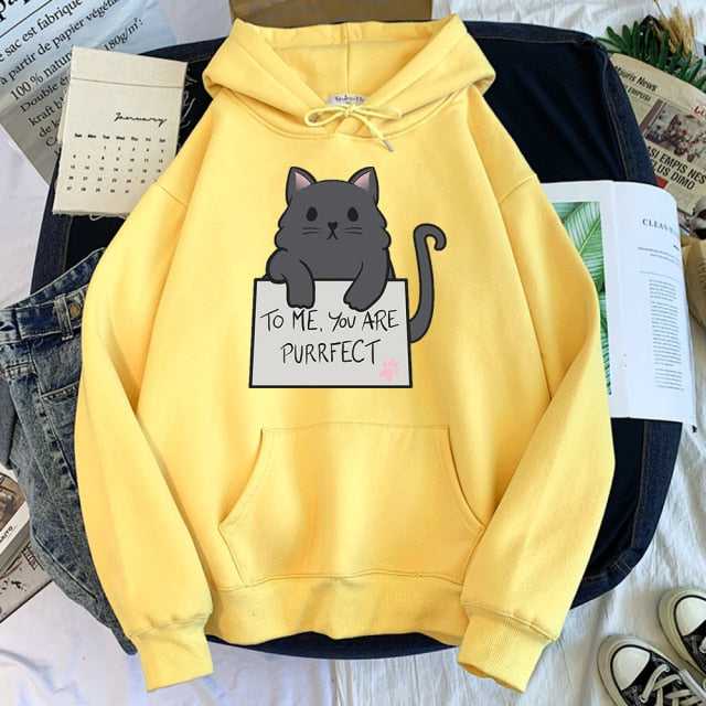 pastel yellow color hoodie with a picture of  a cute and adorable cat holding a sign