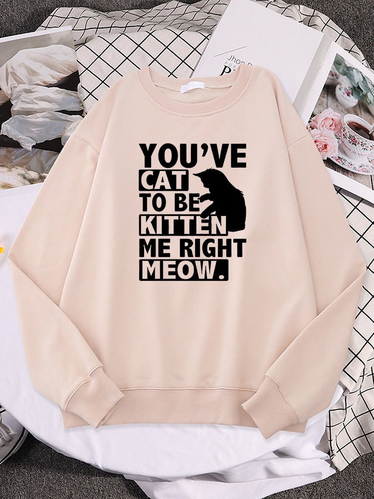 a biege color cat sweaters for humans with funny pun